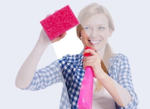 Deep cleaning a fabric sofa to remove stains and dust in Monken Hadley
